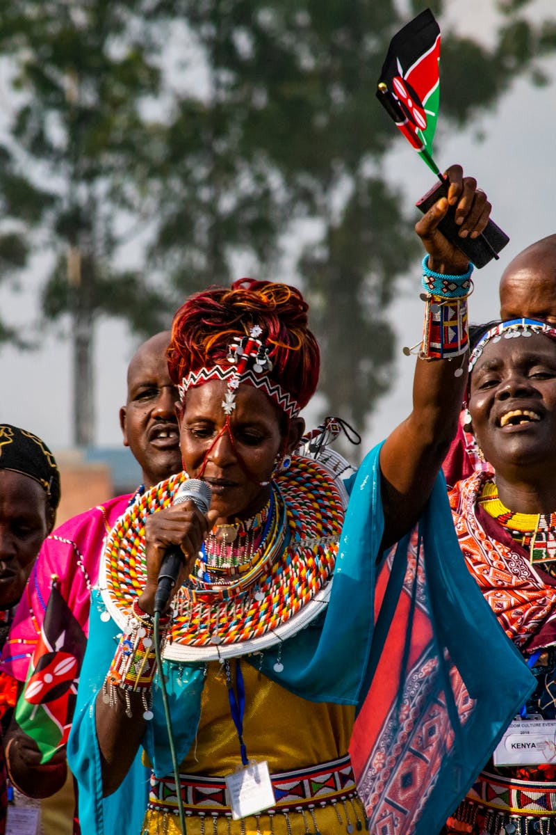 Vibrant cultural performance in Rwanda featuring traditional clothing and singing.
