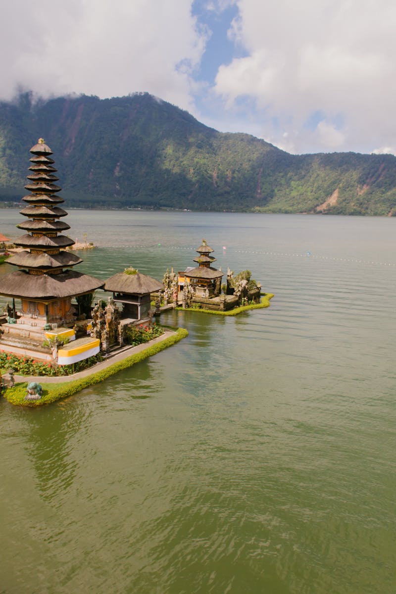 A stunning aerial view of Pura Ulun Danu Bratan Temple situated by a serene lake in the highlands of Bali, Indonesia.